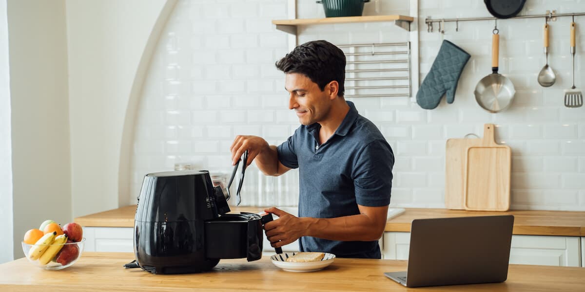 Man using air fryer